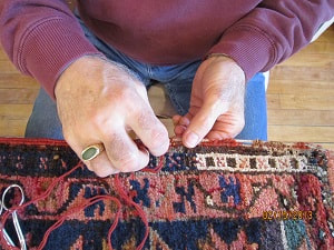 Hand repair of Oriental Rugs